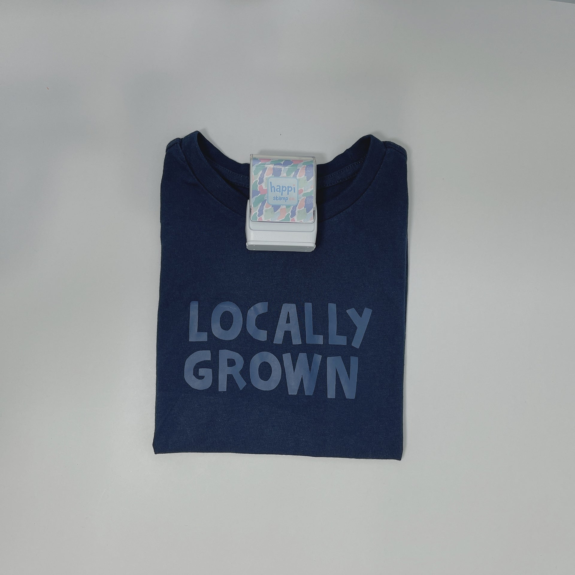 Load video: how to use happi clothing stamp with white ink